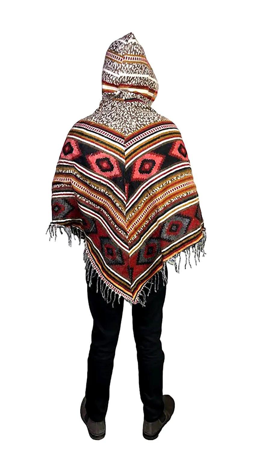 A person stands facing away, wearing the aruna kullu handloom "kullu shawl woolen poncho with hood multinew" featuring a colorful geometric pattern and fringed edges, paired with black pants and dark shoes, isolated on a white background.